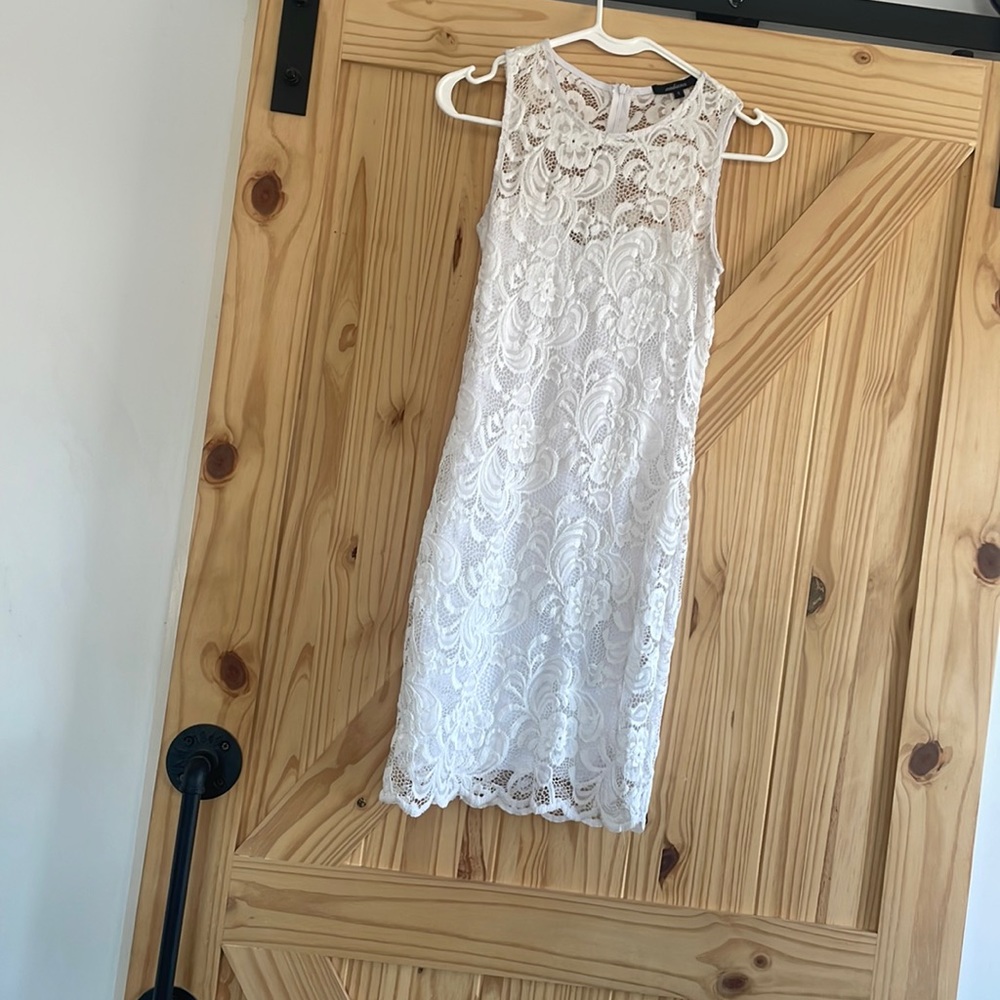 Short right white dress, size small and is ambiance brand